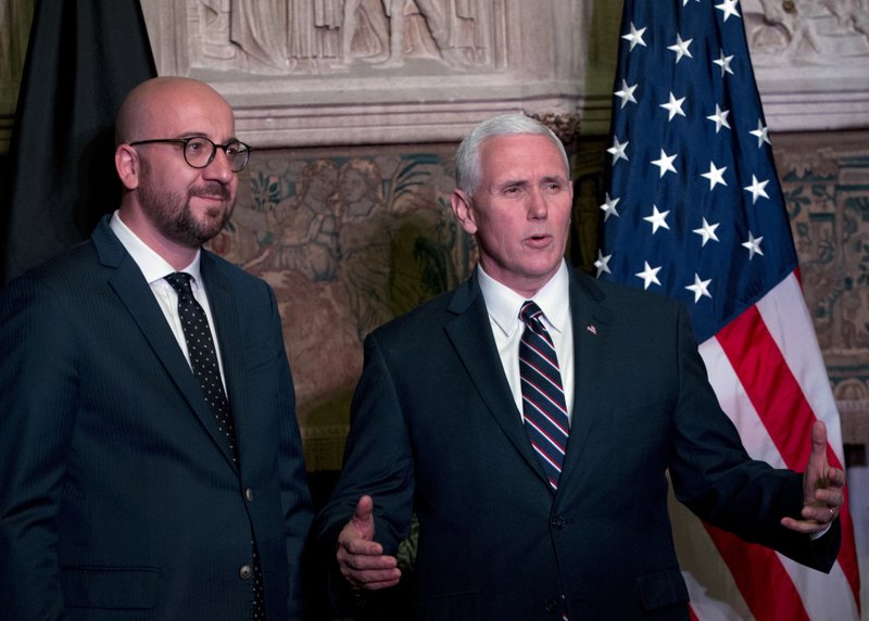 United States Vice President Mike Pence, right, speaks with Belgian Prime Minister Charles Michel during a meeting at Val Duchesse in Brussels on Sunday, Feb. 19, 2017. U.S. Vice President Pence is currently on a two-day visit to meet with Belgian, EU and NATO officials. (AP Photo/Virginia Mayo, Pool)