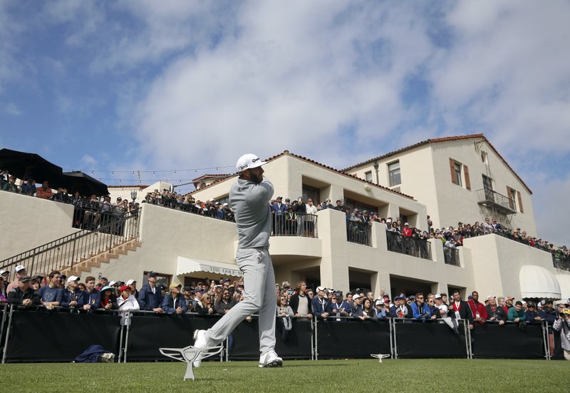 The Associated Press TOP OF THE WORLD: Dustin Johnson tees off on the first hole during the final round of the Genesis Open golf tournament at Riviera Country Club, Sunday in the Pacific Palisades area of Los Angeles. Johnson&#8217;s win earned him the top golf ranking in the world.