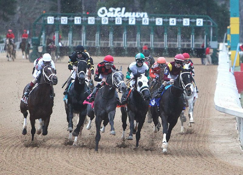 Morning-line favorite Uncontested (far right), ridden by jockey Channing Hill, leads a field of 12 horses into the first turn during the $500,000 Southwest Stakes on Monday at Oaklawn Park in Hot Springs. One Liner, with jockey John Velazquez (far left) aboard, pulled away down the stretch to win the race in front of a crowd of 23,500 and remain unbeaten in three career starts.