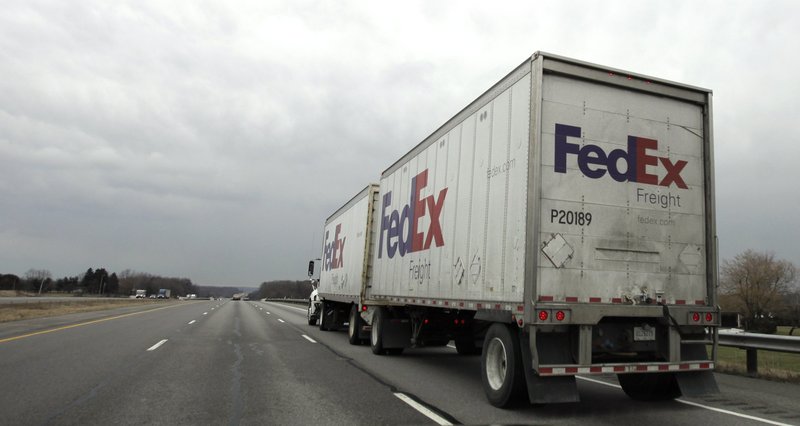 In this 2010 file photo, a Fed Ex truck drives along the highway near Mansfield, Ohio.