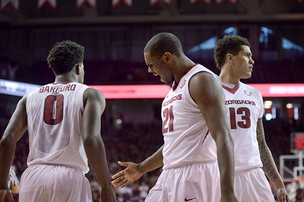 Arkansas senior Manny Watkins (21) celebrates during a game against Ole Miss on Saturday, Feb. 18, 2017, in Fayetteville. 