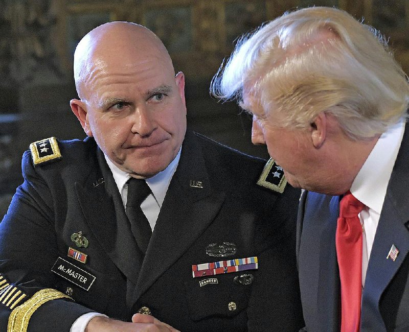 President Donald Trump on Monday congratulates Army Lt. Gen. H.R. McMaster at Trump’s Mar-a-Lago estate in Palm Beach, Fla., where McMaster was announced as the new national security adviser.