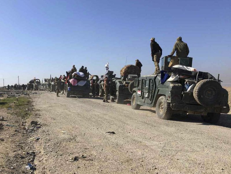 Iraqi security forces push into Mosul from the south on Tuesday. The troops have not yet faced as many car bombs as they did in their advance last year on eastern Mosul.