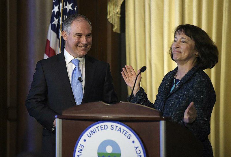 Scott Pruitt prepares to address workers Tuesday at the Environmental Protection Agency headquarters in Washington after being introduced by acting EPA chief Catherine McCabe.