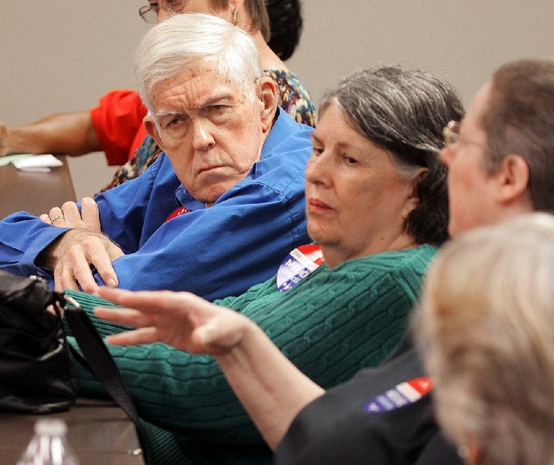 Medicare Advantage recipients Raymond Tromater (left) and his wife, Rebeccah (center), participate in a roundtable discussion about the federal Medicare Advantage program during an event with Sen. Tom Cotton and The Coalition for Medicare Choices at CareLink in North Little Rock.
