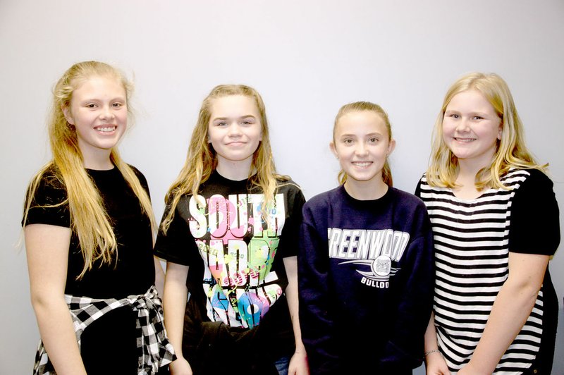 LYNN KUTTER ENTERPRISE-LEADER Carli Huffaker, left, Zoe Shue, Randi Kistler and Sarah Remington are planning a Tornado Town Hall meeting as part of a team project in their EAST class at Lincoln Middle School. The Town Hall meeting will be 6 p.m. Feb. 28 in the auditorium.