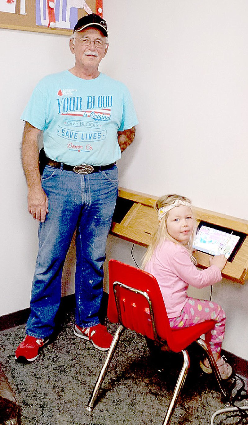 Photo submitted Mike Marrs donated his time and materials to build an iPad station in the Children&#8217;s Area at the Bella Vista Public Library. The kids and parents love it.