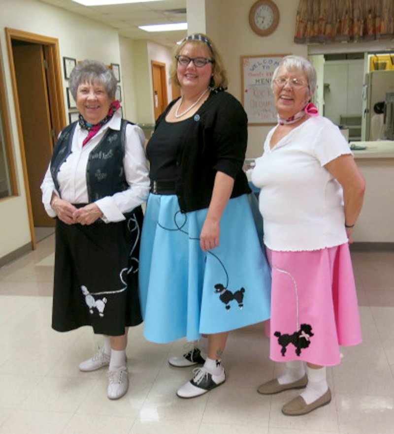 Photo by Susan Holland Mary Kay Kelley, director of the Billy V. Hall Senior Activity and Wellness Center; Melissa Steele, program assistant at the Center; and Joie &quot;Penny&quot; Leonard, a resident in the Senior Center housing, paused to show off their poodle skirts at the sock hop last Friday at the Center. Leonard was chosen winner among the women in the costume contest.