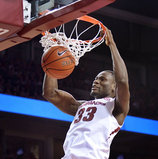 NWA Democrat-Gazette/BEN GOFF COMING IN HOT: Moses Kingsley of Arkansas dunks against Ole Miss in the second half Saturday during the game at Bud Walton Arena in Fayetteville. The Hogs are on a three-game streak, but they need to have strong rebounding to beat Texas A&M tomorrow.