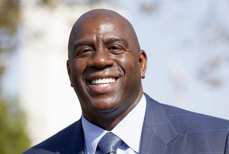 The Associated Press LAKE SHOW: Magic Johnson speaks at a groundbreaking ceremony for a stadium which will be home to the Los Angeles Football Club on Aug. 23, 2016, in Los Angeles. The Los Angeles Lakers fired general manager Mitch Kupchak Tuesday and put Johnson in charge of basketball operations in a major shake-up of the struggling franchise's front office.