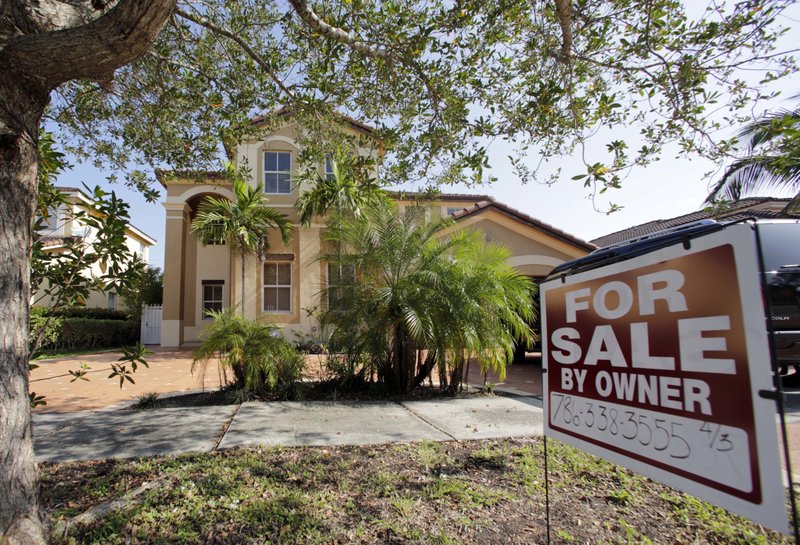 This Dec. 7, 2016 file photo shows a house for sale, in Hialeah, Fla. Americans shrugged off rising mortgage rates and bought existing homes in January 2017 at the fastest pace since 2007. The National Association of Realtors on Wednesday, Feb. 22, 2017, says home sales rose 3.3 percent last months from December to a seasonally adjusted annual rate of 5.69 million. (AP Photo/Alan Diaz, File)
