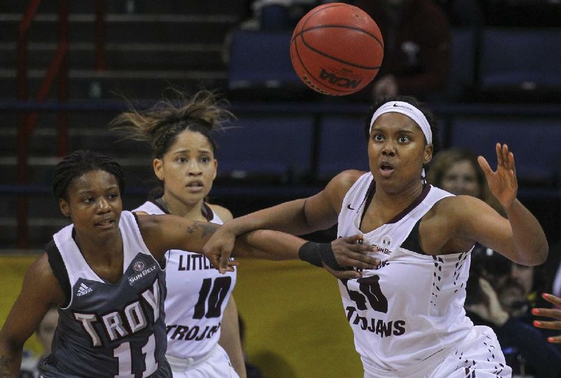 In this file photo UALR's Kaitlyn Pratt steals the ball from Troy's ArJae Saunders during UALR's one point loss in the finals of the Sun Belt Conference Women's Tournament Championships in New Orleans.