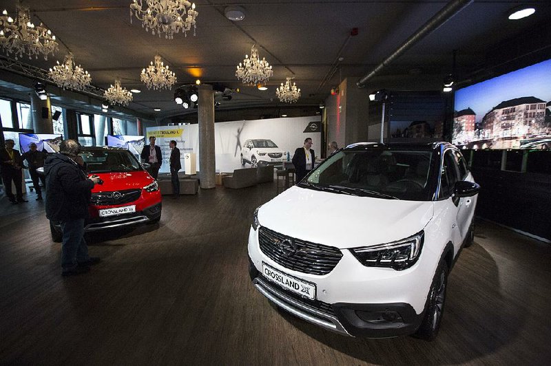 Opel Crossland X sport utility vehicles are displayed Monday at a new-model release event in Frankfurt, Germany.