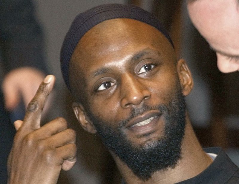  In this Dec. 17, 2004 file photo, Jamal al-Harith, of Britain, a former inmate at Guantanamo Bay, gestures after his testimony to Europe's top human rights body in Paris. The Islamic State group identified Abu Zakariya al-Britani, a suicide bomber who attacked a military base in Iraq this week who was a former Guantanamo Bay detainee freed in 2004 after Britain lobbied for his release. 