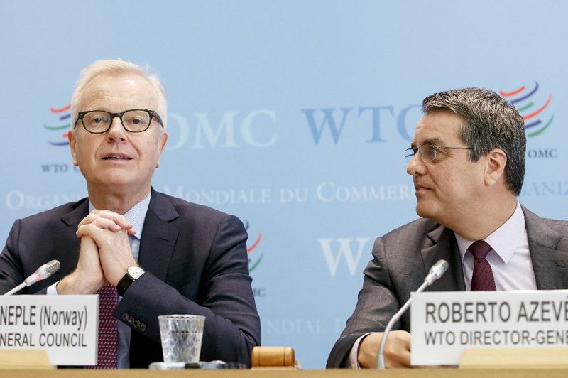 Harald Neple, chairman of the World Trade Organization’s General Council, and WTO Director-General Roberto Azevedo meet with reporters Wednesday in Geneva.