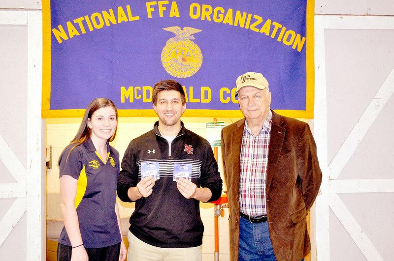RACHEL DICKERSON MCDONALD COUNTY PRESS Farm Bureau recently donated $350, and Harps donated $25 to the McDonald County High School food pantry. Pictured, from left, are Madison Mitchell, FFA president, Michael Shaddox, high school counselor, and John Hobbs of Farm Bureau.