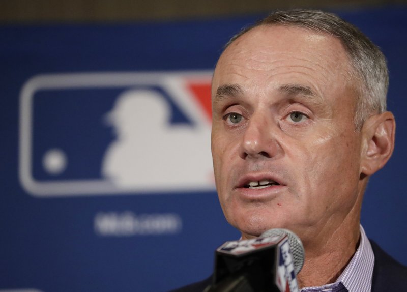 Major League Baseball Commissioner Rob Manfred answers questions at a news conference Tuesday, Feb. 21, 2017, in Phoenix. (AP Photo/Morry Gash)