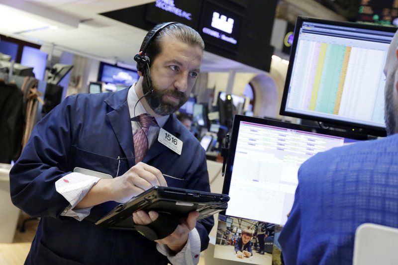 Trader Greg Mulligan on the floor of the New York Stock Exchange, Wednesday, Feb. 22, 2017. Declines in energy and industrial stocks are leading U.S. indexes slightly lower in early trading as the market comes off a record closing high the day before. (AP Photo/Richard Drew)