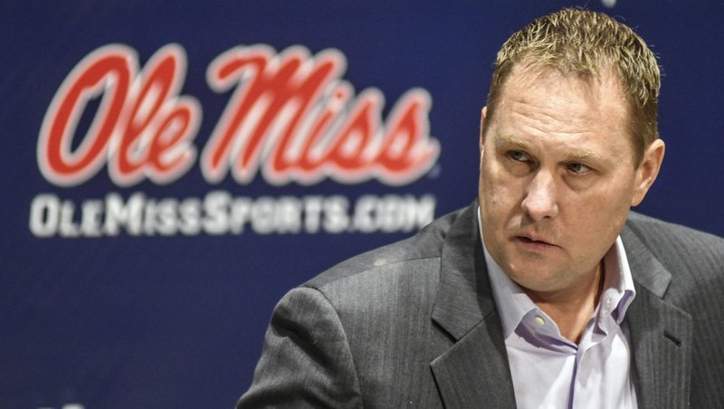 FILE - This Dec. 16, 2016 file photo shows Mississippi NCAA college head football coach Hugh freeze speaking during a news conference at the Manning Center in Oxford, Miss. Mississippi's football team will not play in the postseason next year. The Rebels might be facing more penalties, too, now that the NCAA says the program has committed more than 20 rules violations over the past several years. (Bruce Newman/Oxford Eagle via AP)