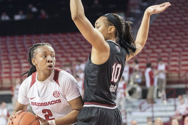 Arkansas' Aaliyah Wilson looks for help while South Carolina's Allisha Gray defends Sunday Feb. 5, 2017 at Bud Walton Arena in Fayetteville. South Carolina won 79-49.