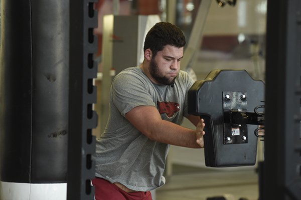 Arkansas offensive lineman Shane Clenin goes through a workout Tuesday, Jan. 31, 2017, at Fred W. Smith Center in Fayetteville. 
