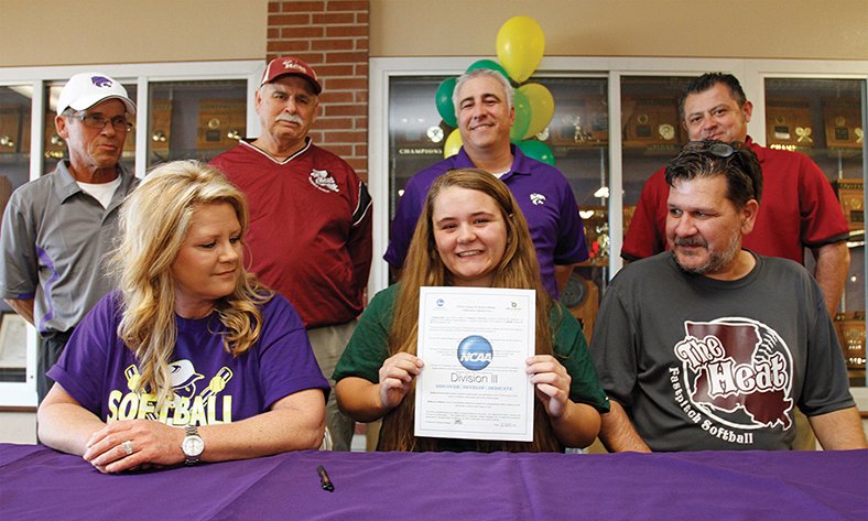 Terrance Armstard/News-Times Staff El Dorado High School’s Marissa Rice, center, signs with Belhaven University. Her mother Leslie, seated left, and father Michael, seated right, accompany Marissa. Standing are volunteer assistant softball coach Mark Conway, select team coach of The Heat, Rory Gresham, EHS head coach Chris Ezell and Michael Aydelotte of No Fear.
