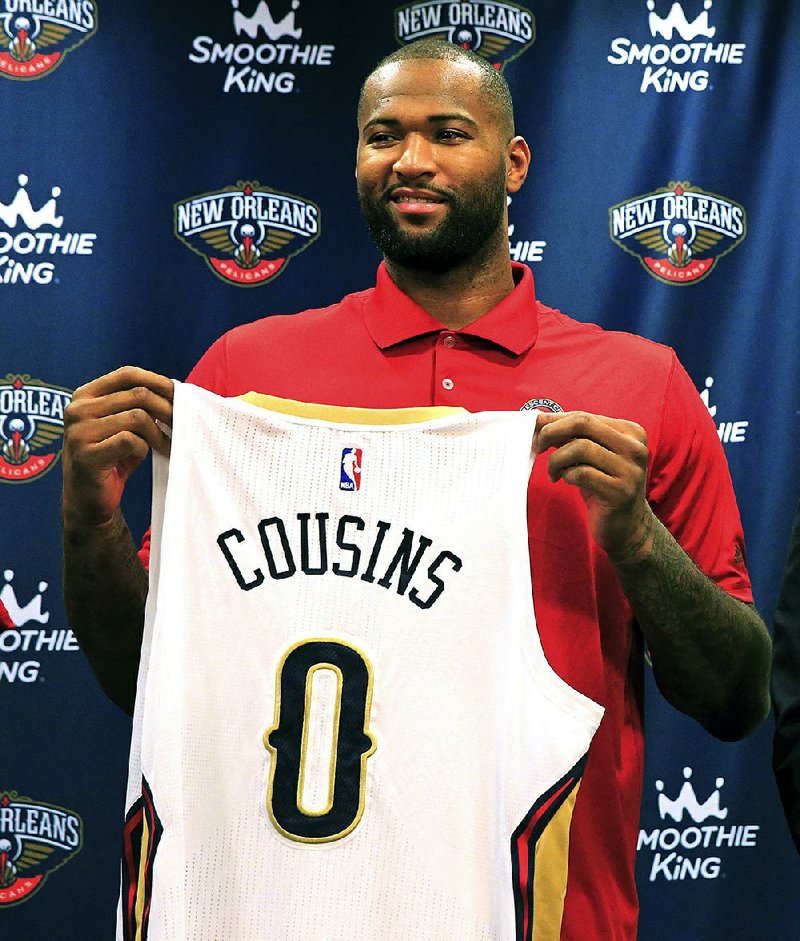DeMarcus Cousins holds his new jersey "0" during a  news conference on Wednesday, Feb. 22, 2017 in Metairie, La.  