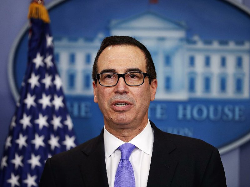 In this Feb. 14, 2017 file photo, Treasury Secretary Steven Mnuchin speaks to the media during the daily briefing in the Brady Press Briefing Room of the White House in Washington.  