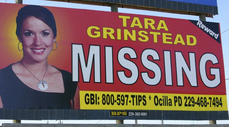 FILE - The Wednesday, Oct. 4, 2006, file photo of missing teacher Tara Grinstead is prominently displayed on a billboard in Ocilla, Ga. Grinstead's disappearance on Oct. 22, 2005, was marked by a ceremony in Ocilla. Authorities in rural south Georgia say they plan to update the public, Thursday, Feb. 23, 2017, on their 11-year search for a missing teacher. A former beauty queen who taught at Irwin County High School, Grinstead was 30 years old when she vanished in October 2005 from her home. (AP Photo/Elliott Minor, File)
