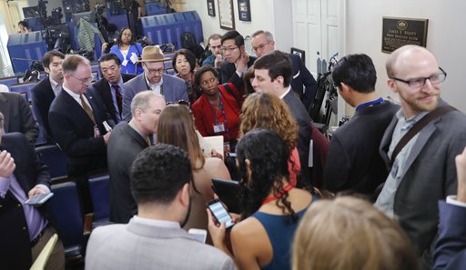 Reporters line up in hopes of attending a briefing in Press Secretary Sean Spicer's office at the White House in Washington on Friday, Feb. 24, 2017. 