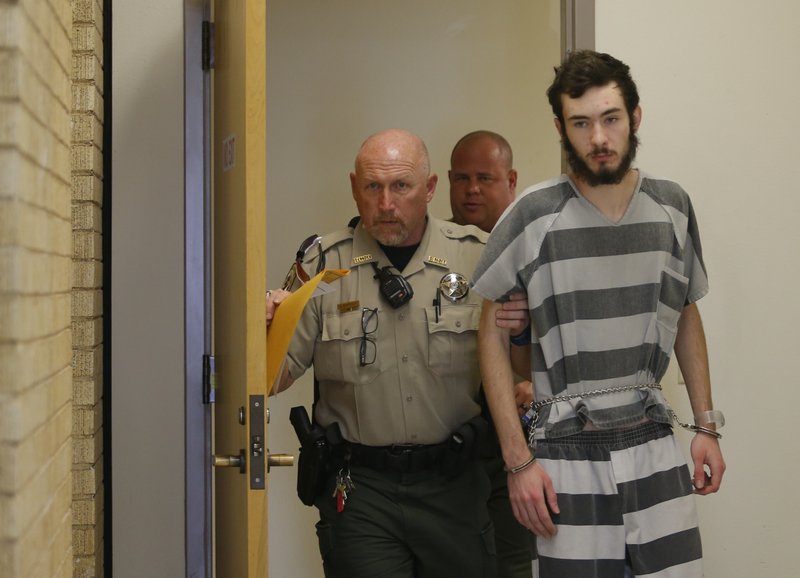 Deputies accompany Austin Grammer, 18, at the Benton County Courthouse Friday.