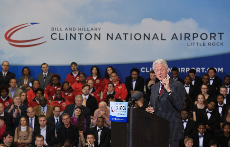 Former President Bill Clinton walks on stage at the 2013 dedication of the Bill and Hillary Clinton National Airport in Little Rock.