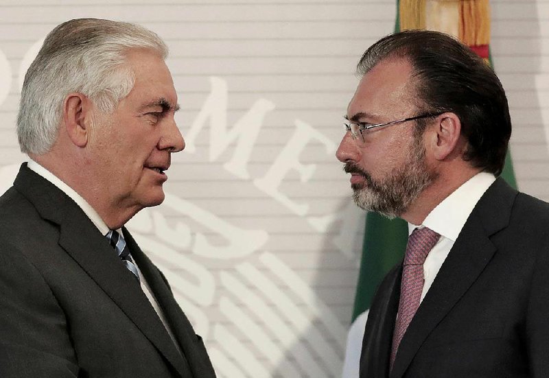 U.S. Secretary of State Rex Tillerson (left) and Mexican Foreign Affairs Minister Luis Videgaray meet Thursday in Mexico City, where Videgaray said “immigration policy can’t be unilateral.”