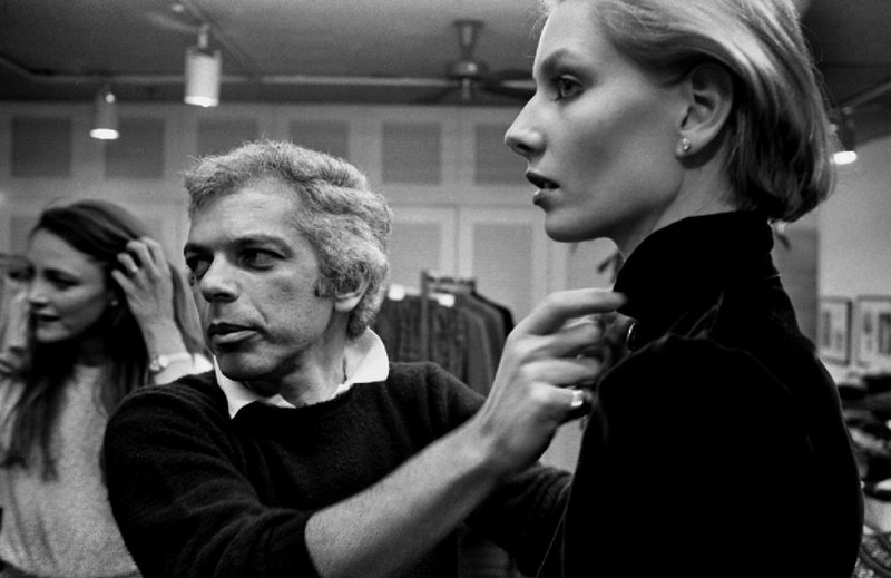 Ralph Lauren preps a model in his showroom for a photo shoot during Fashion Week in March 1980. 