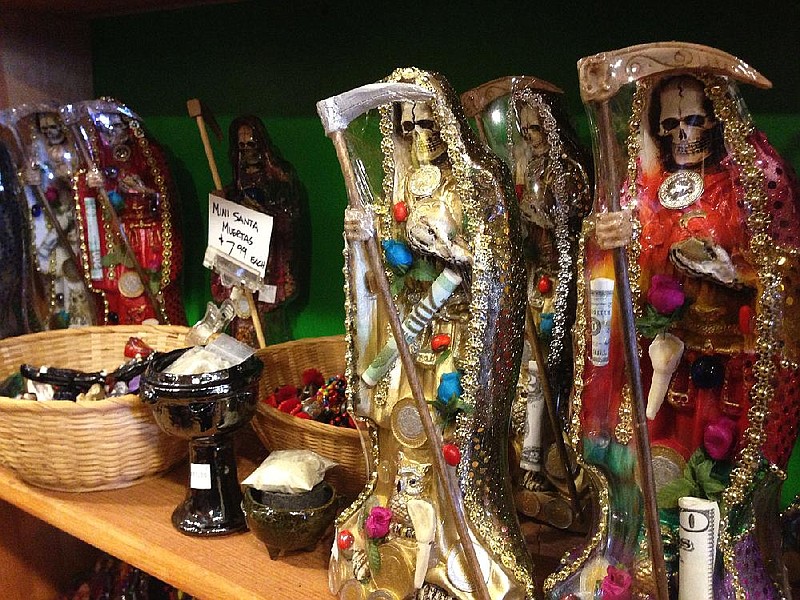 Statues of La Santa Muerte are displayed at the Masks y Mas art store in Albuquerque, N.M. Catholic bishops in the United States are denouncing the skeleton folk saint as spiritually dangerous and contrary to the teachings of Jesus.
