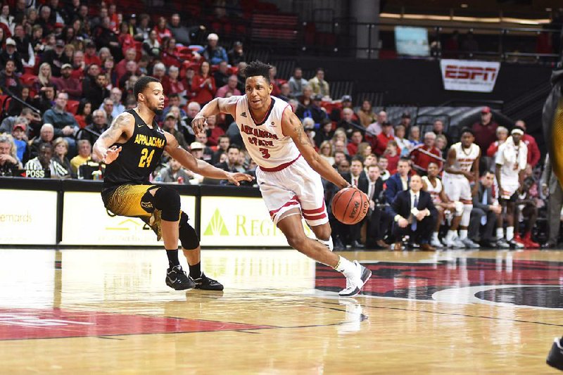 Arkansas State University guard Devin Carter (right) decided to stick with the Red Wolves after Grant McCasland was hired as their new coach in March. Now, the senior has a chance to lead the team to a 20-victory season for the first time since 1998.