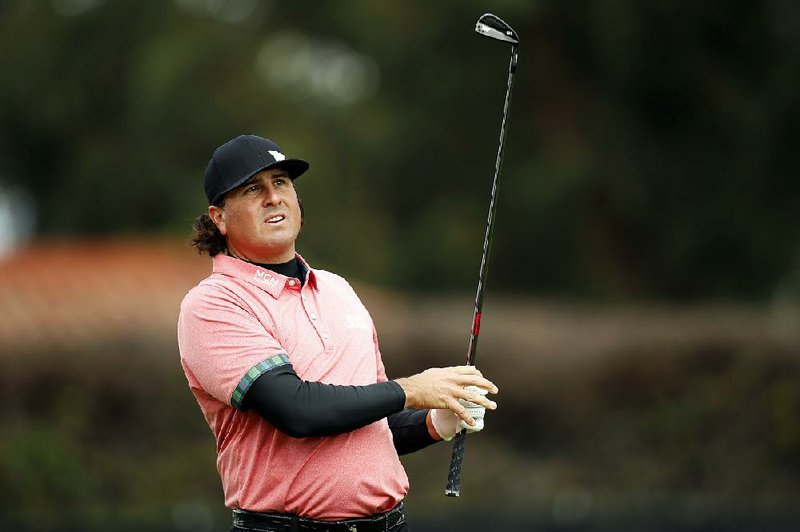 Pat Perez follows his tee shot on the 14th hole during the second round of the Genesis Open golf tournament at Riviera Country Club, Saturday, Feb. 18, 2017, in the Pacific Palisades area of Los Angeles. 