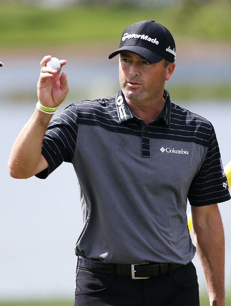 Ryan Palmer acknowledges the crowd as he finishes the second round of the Honda Classic golf tournament, Friday, Feb. 24, 2017, in Palm Beach Gardens, Fla. 