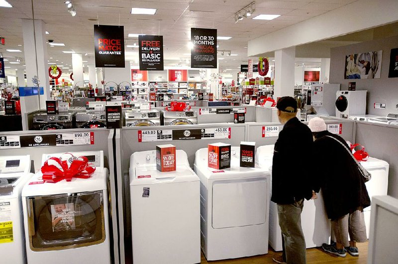 Shoppers browse appliances at a J.C. Penney Co. store in Garden City, N.Y., in this file photo. Penney started selling major appliances again after a failed reinvention that started in 2012.
