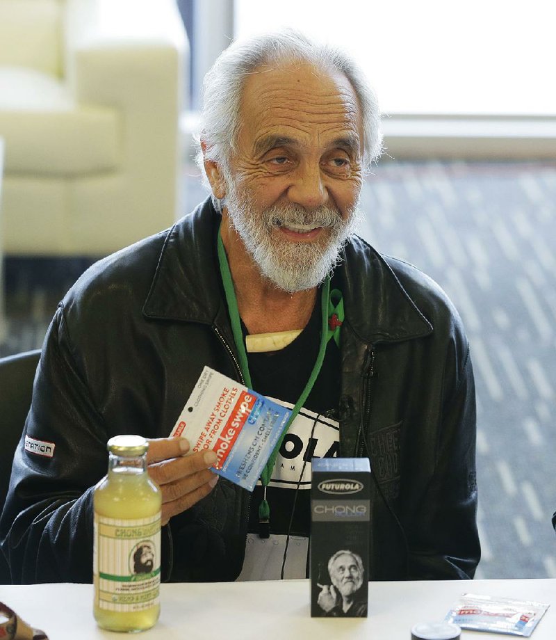 In this Feb. 19, 2015 file photo, comedian and marijuana icon Tommy Chong, talks about his line of marijuana products, including his "Chongwater" hemp drink, a custom joint roller, and his "Smoke Swipe" wipes that can remove the odor of pot smoke from clothing, during CannaCon, a marijuana business trade show in Seattle. Chong tweeted Thursday, Feb. 23, 2017, "Don't worry stay High" in response to a potential crackdown on recreational pot use by the Trump administration.  