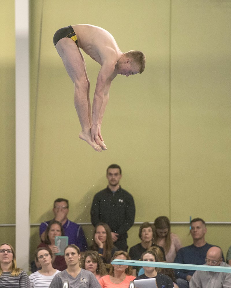 NWA Democrat-Gazette/ANTHONY REYES @NWATONYR Kyle Nichols of Bentonville High performs his final dive Friday during the Arkansas High School Swim and Dive Championships at the Bentonville Community Center in Bentonville.