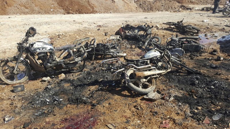 This image released by the Thiqa News Agency, burned motorcycles that damaged after a suicide attacker blew his small pick-up truck outside a security office in Sousian village, about 8 kilometers (5 miles) north of al-Bab, Friday, Feb. 24, 2017. 