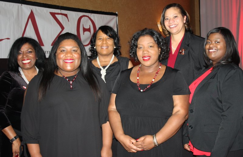 Rachel Johnston (from left), Tiffany Hughes-Butler, Letitia Johnson, Aterra Lowe, Stephanie Adams and Catandra Johnson, Delta Sigma Theta Crimson and Cream committee members, gather at the scholarship benefit luncheon Feb. 18.