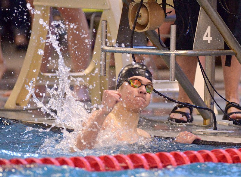 Andersen Mainord of Conway celebrates after winning the boys' 100-yard butterfly in 52.22 seconds Saturday at the Bentonville Community Center.