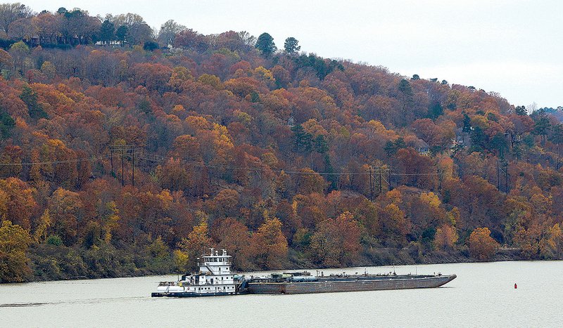 A towboat pushes a barge in December on the Arkansas River near Murray Lock and Dam. 
