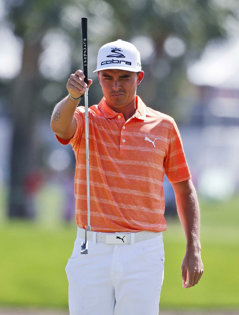 Rickie Fowler lines up a putt on the first hole during the final round of the Honda Classic golf tournament, Sunday, Feb. 26, 2017, in Palm Beach Gardens, Fla. 