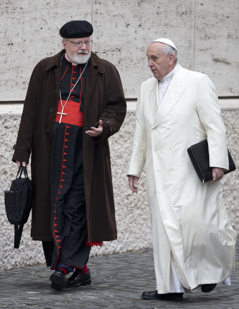 In this Feb. 13, 2015 file photo, Pope Francis, right, talks with the head of a sex abuse advisory commission, Cardinal Sean Patrick O'Malley, of Boston, as they arrive for a special consistory in the Synod hall at the Vatican. 