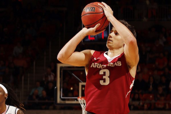 Arkansas guard Dusty Hannahs (3) shoots a 3-pointer against Auburn during the first half of an NCAA college basketball game Saturday, Feb. 25, 2017, in Auburn, Ala. (AP Photo/Todd J. Van Emst)