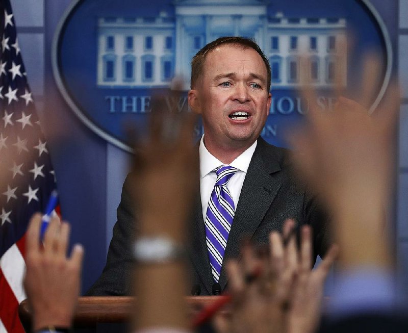Mick Mulvaney, director of the Office of Management and Budget, speaks to White House reporters Monday about President Donald Trump’s spending blueprint.