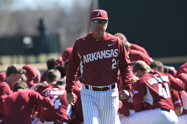 Arkansas coach Dave Van Horn walks away from a team huddle prior to a game against Bryant on Saturday, Feb. 25, 2017, in Fayetteville. 